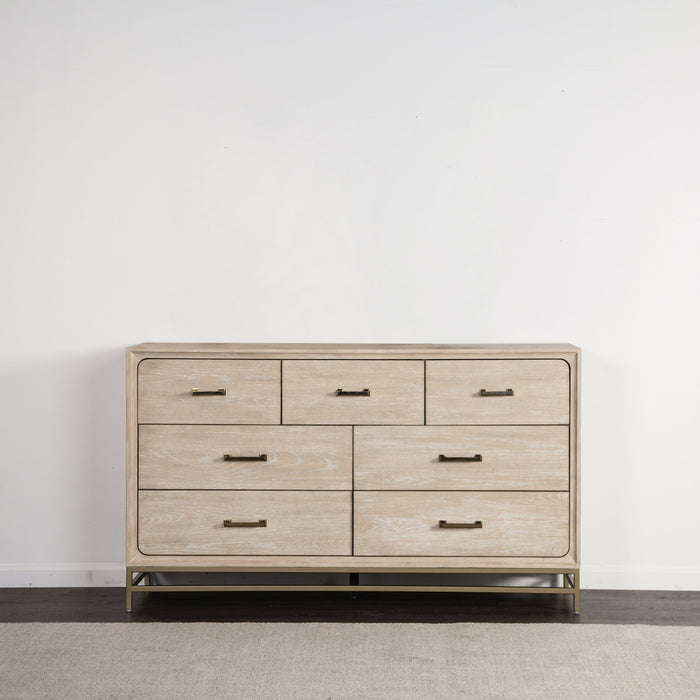 Front facing transitional light oak seven-drawer dresser with a metal base in a room