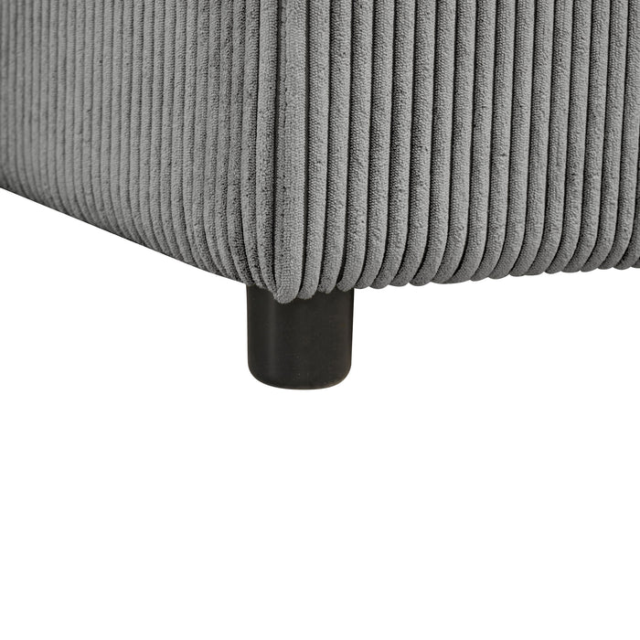 Close-up leg detail of a chenille reversible sectional with storage chaise on a white background